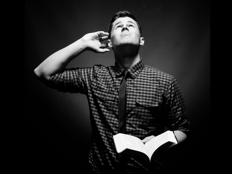 Can you hear me - a man holding a Bible and looking up to God (Credit: Prixel Creative via Lightstock)