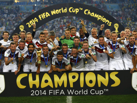 Germany players celebrate with their trophy after winning the 2014 World Cup final between Germany and Argentina at the Maracana stadium in Rio de Janeiro July 13, 2014. (Credit: Reuters/Darren Staples)