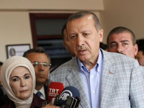 Prime Minister and presidential candidate Tayyip Erdogan talks with media during presidential elections in Istanbul August 10, 2014 (Credit: Reuters/Murad Sezer)