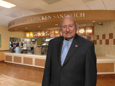 S Truett Cathy, Founder and Chairman of Chick-fil-A, poses for a promotional photo in an empty Chick-fil-A store (Credit: truettcathy.com)