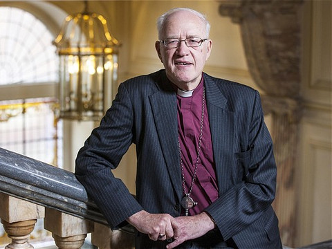 Lord George Carey, former Archbishop of Canterbury, poses for a photo on a staircase inside the Archbishop residence (Credit: The Telegraph/Andrew Crowley)