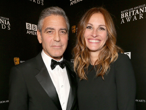 George Clooney and Julia Roberts pose for photos after Clooney won the prestigious Stanley Kubrick Britannia Award for Excellence in Film at the BAFTA Los Angeles Jaguar Britannia Awards, which was presented to him by his good friend Julia Roberts at the Beverly Hilton Hotel in Beverly Hills, California November 9, 2013 (Credit: BAFTA/Christopher Polk)