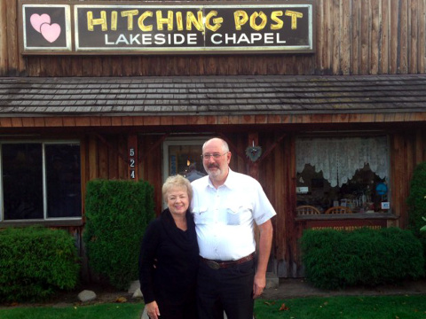 Idaho ministers Donald and Evelyn Knapp, who say they have been threatened with jail time for refusing to conduct same-sex marriages, pose for a photo before their chapel, the Hitching Post Lakeside Chapel (Credit: Alliance Defending Freedom)