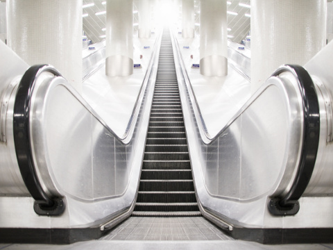 A non-operational, empty escalator at King's Cross underground railway station on the northern edge of London at the junction of Euston Road and York Way, in the London Borough of Camden on the boundary with the London Borough of Islington (Credit: Chris Jones via Flickr)