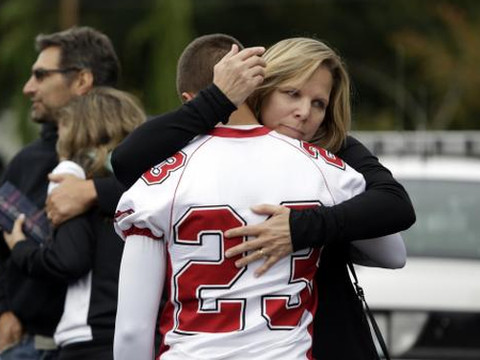 Students and family members reunite at Shoultes Gospel Hall after a student opened fire at Marysville-Pilchuck High School, in Marysville, Washington October 24, 2014 (Credit: Reuters/Jason Redmond)