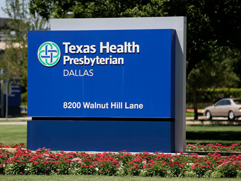 A sign outside the main entrance of Texas Health Presbyterian Hospital in Dallas on Walnut Hill Lane, the site of the first reported US case (Credit: AP/Tony Guiterrez)