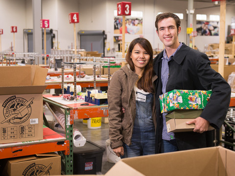 Tyrel and Joana Wolfe, a newly-married couple who connected as children through Operation Christmas Child, brought their gifts to Samaritan's Purse international headquarters during national shoebox collection week (Credit: Samaritan's Purse)