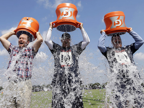 Houston Texans Coach Bill O'Brien (center) Chief Operating Officer Cal McNair (right) and Houston Chronicle reporter Brian Smith take the ALS Ice Bucket Challenge Thursday to raise money for the ALS Association. (Credit: AP/David J. Phillip)
