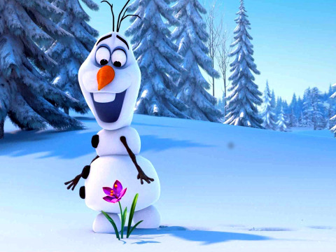 Olaf, the snowman from Disney's Frozen, smiles as he looks at a flower (Credit: Disney Movies)
