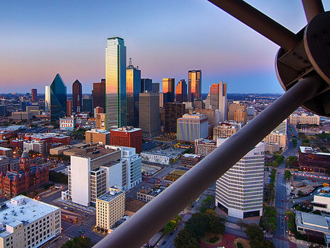 A view of downtown Dallas at dusk as seen from the GeO-Deck of Reunion Tower, south of the city center, March 29, 2014 (Credit: Robert Hensley via Flickr)