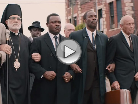 David Oyelowo as Martin Luther King (2nd from left) marches arm in arm across bridge in Selma, Alabama in a scene from the Paramount Pictures movie Selma (Credit: Paramount Pictures)