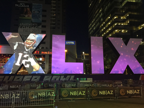 Super-sized Super Bowl 49 roman numerals lit up at night in Super Bowl Central in downtown Phoenix, Arizona, January 28, 2015 (Credit: 12News/Zach Boyd)