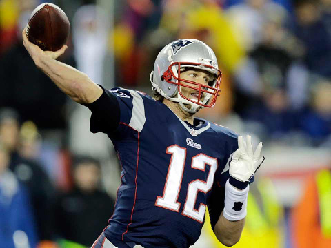 New England Patriots quarterback Tom Brady (12) throws during the first half of the NFL football AFC Championship game against the Indianapolis Colts Sunday, January 18, 2015 (Credit: AP/Charles Krupa)