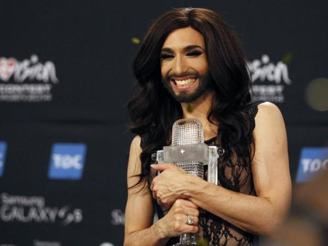 Austrian drag queen Conchita Wurst poses with the trophy after winning the 59th annual Eurovision Song Contest at the B&W Hallerne in Copenhagen May 11, 2014 (Credit: Reuters/Tobias Schwarz)