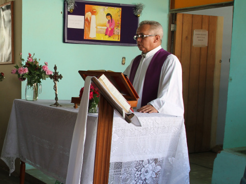 Father Castro Cirilo, a priest in the Roman Catholic church, celebrates Mass in a converted garage in the Cuban village of Sandino, the site of the first Roman Catholic Church to be built in Cuba in 56 years (Credit: CNN)