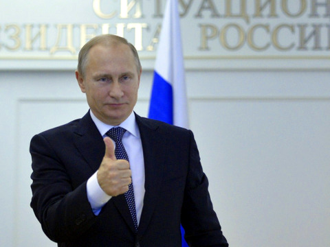 Russian President Vladimir Putin gestures as he watches the launch of the newest heavy-class Angara-A5 rocket at Plesetsk cosmodrome in Arkhangelsk region, via a video link at the Russian Presidential Situation center at the Kremlin in Moscow, December 23, 2014 (Credit: Reuters/Alexei Druzhinin)