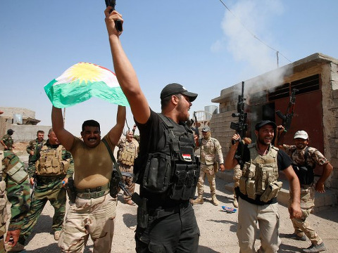 Kurdish peshmerga forces celebrate as they take control of the town of Sulaiman Pek, that had been occupied by ISIS militants for three months, September 1, 2014 (Credit: Reuters/Youssef Boudlal)