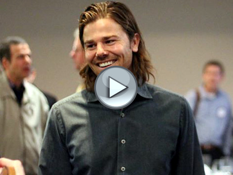 Dan Price, CEO of Gravity Payments, who reduced his salary from $1 million a year to $70,000, speaks with attendees at a Rotary Club of Seattle event, February 19, 2015 (Credit: Gravity Payments via Facebook)