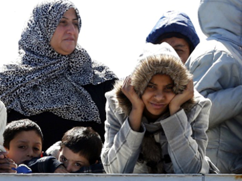 Migrants arrive at the Sicilian harbour of Augusta on Tuesday aboard an Italian naval vessel, April 21, 2015 (Credit: Reuters/Alessandro Bianchi)