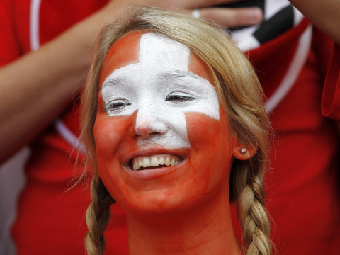 'A Switzerland fan smiles while attending their men's Group B football match against South Korea in the London 2012 Olympic Games at the City of Coventry stadium, July 29, 2012 (Credit: Reuters/Yves Herman)