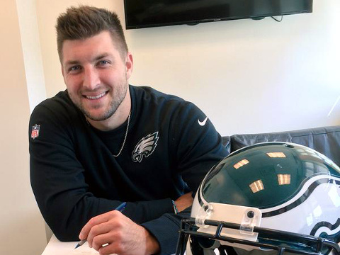 Tim Tebow smiles at the camera as he signs a one-year contract Monday afternoon with the Philadelphia Eagles, April 20, 2015 (Credit: Philadelphia Eagles)
