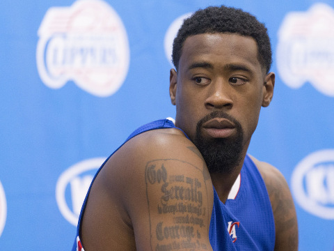 DeAndre Jordan watches while a teammate answers a question from a reporter during the Los Angeles Clippers Media Day, September 29, 2014 (Credit: Panoramic/Icon Sportswire)