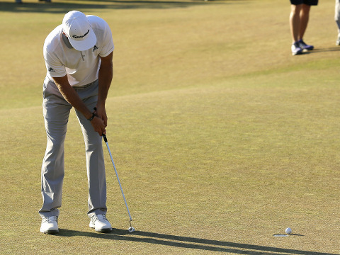 Dustin Johnson three putts the 18th hole during the final round of the U.S. Open golf tournament at Chambers Bay on Sunday, June 21, 2015 in University Place, Washington (Credit: AP Photo/Lenny Ignelzi)