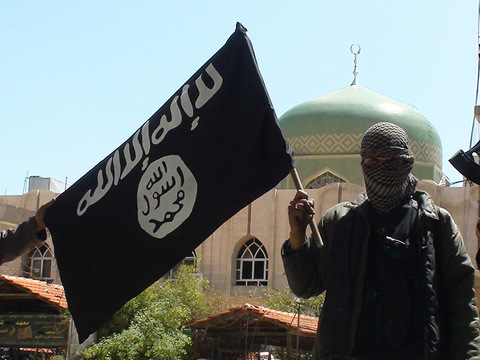 Islamic State group militants posing in Yarmouk Palestinian camp, located in a suburb of Damascus, Syria, that is partially now under their control, April 7, 2015 (Credit: AP/SIPA USA/Balkis Press)