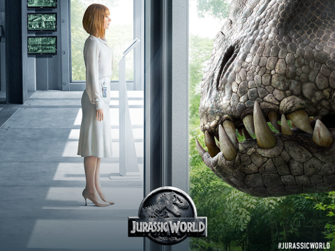 Bryce Dallas Howard, the park operations manager of Jurassic World, stands on a view platform face-to-face with a T-Rex, in a scene from the new Universal Pictures movie, Jurassic World, the fourth installment in the Jurassic Park franchise (Credit: Universal Pictures)