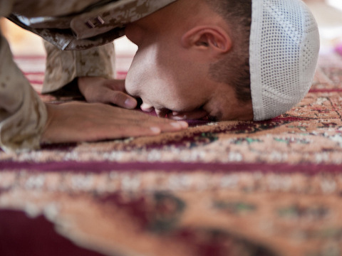 Lieutenant Asif I. Balbale, the chaplain for Assault Amphibian School Battalion at Marine Corps Base Camp Pendelton, California, prays by himself at the Afghan Cultural Center aboard Camp Leatherneck, Helmand province, August 17, 2011, Afghanistan (Credit: United States Marines/Petty Officer 2nd Class Jonathan Chandler)