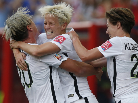 United States' Megan Rapinoe, center,, Abby Wambach (20) and Meghan Klingenberg (22) celebrate Rapinoe's goal against Australia during a FIFA Women's World Cup soccer match in Winnipeg, Manitoba, Monday, June 8, 2015 (Credit: AP/The Canadian Press/John Woods)