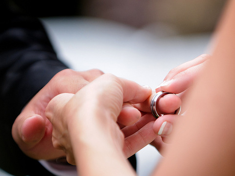 Bride putting ring on groom - Kingston Plantation - North Myrtle Beach (Credit: Ryan G. Smith via Flickr)
