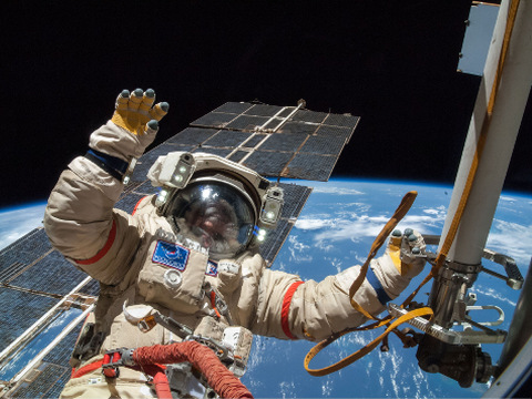 Russian cosmonaut Alexander Skvortsov, Expedition 40 flight engineer, attired in a Russian Orlan spacesuit, participates in a session of extravehicular activity (EVA) in support of science and maintenance on the International Space Station, deploying a small science satellite, retrieving and installing experiment packages and inspecting components on the exterior of the orbital laboratory, August 18, 2014 (Credit: Sipa via AP Images)