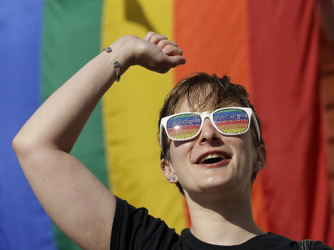 Jessica Chesnutt, visiting from Brooklyn with her wife for Pride weekend, cheers outside of City Hall in San Francisco, Friday, June 26, 2015, following a ruling by the U.S. Supreme Court that same-sex couples have the right to marry nationwide. (Credit: AP Photo/Jeff Chiu)