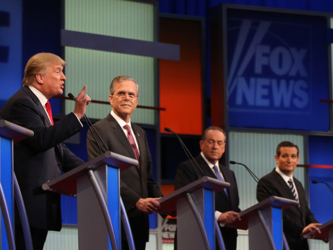 Republican presidential candidate Donald Trump speaks as, Jeb Bush, Mike Huckabee and Ted Cruz listen duringthe first Republican presidential debate at the Quicken Loans Arena, Cleveland, Ohio, August 6, 2015 (Credit: AP Photo/Andrew Harnik)