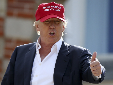 Presidential contender Donald Trump, speaks to the media after arriving by helicopter during the 1st first day of the Women's British Open golf championship on the Turnberry golf course in Turnberry, Scotland, July 30, 2015 (Credit: AP Photo/Scott Heppell)