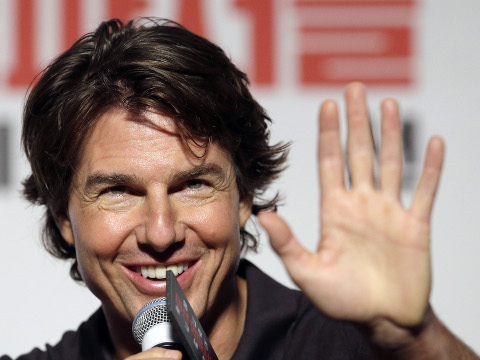 Actor Tom Cruise greets to a reporter as he is questioned during a press conference for his new movie Mission: Impossible - Rogue Nation in Seoul, South Korea, July 30, 2015 (Credit: AP Photo/Lee Jin-man)