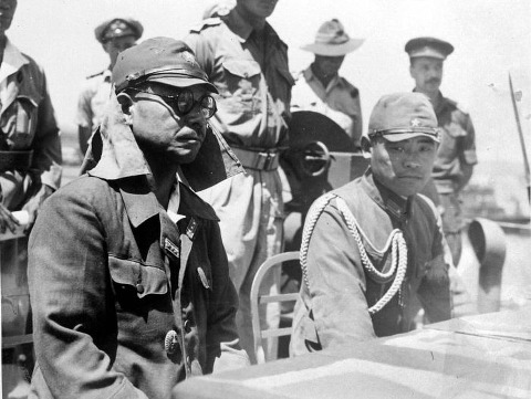 In the port of Kupang (Timor) on the deck of the HMAS Moresby, the Japanese commander Colonel Tatsuichi Kaida and his chief of staff Major Minoru Shoji, listen to the terms of surrender in connection with the capitulation of Japan (Credit: Museum of the Tropics, Amsterdam, Netherlands)