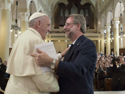 Pope Francis shakes hands with Eugenio Bernardini, the Moderator of the Waldensian Church, during the first ever visit of a pope to the Waldensian evangelical church, in Turin, northern Italy, June 22, 2015 (Credit: AP Photo/L' Osservatore Romano)