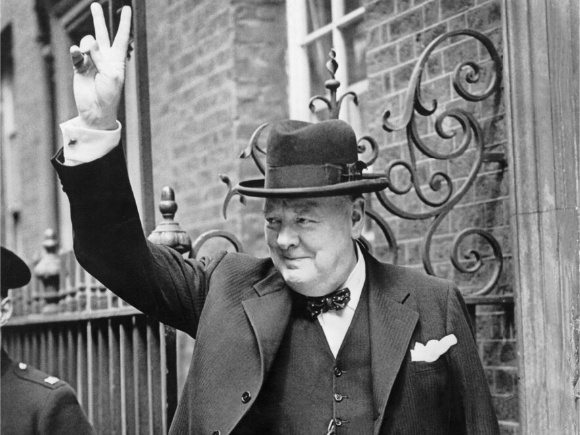 Winston Churchill giving the 'V' sign on Downing Street after arriving back in London from Washington where he had discussions with President Roosevelt (Credit: Imperial War Museum)