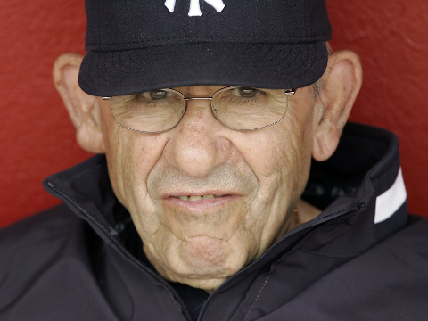 New York Yankees hall of fame catcher Yogi Berra watches spring training baseball action against the Cincinnati Reds in Sarasota, Florida, March 6, 2008 (Credit: AP Photo/Gene J. Puskar)