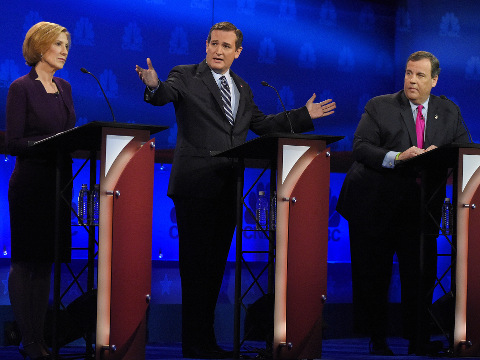 Ted Cruz, center, talks about the mainstream media as Carly Fiorina, left, and Chris Christie look on during the CNBC Republican presidential debate at the University of Colorado in Boulder, Colorado, October 28, 2015 (Credit: AP Photo/Mark J. Terrill)