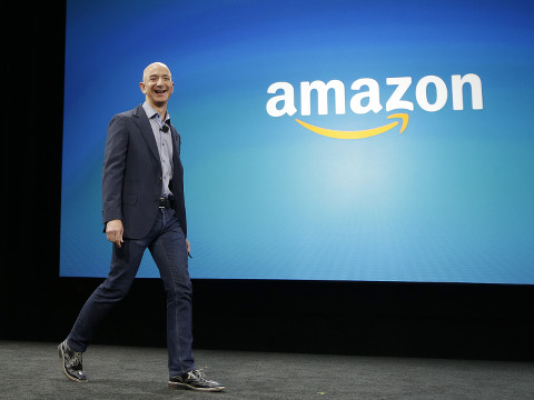 Amazon CEO Jeff Bezos walks on stage for the launch of the new Amazon Fire Phone, Seattle, Washington, June 18, 2014 (Credit: AP Photo/Ted S. Warren)