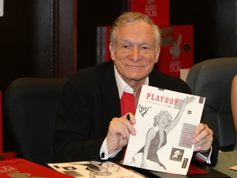 Hugh Hefner signing copies of the Playboy calendar and Playboy Cover To Cover:The 50's DVD box set, November 15, 2007 (Credit: AP Images/Ian West)