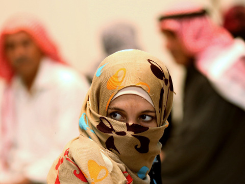 A Syrian refugee waits at a clinic at the Zaatari refugee camp as German Economy Minister Sigmar Gabriel visits the camp near Mafraq, north of Amman, Jordan, September 22, 2015 (Credit: AP Photo/Raad Adayleh)