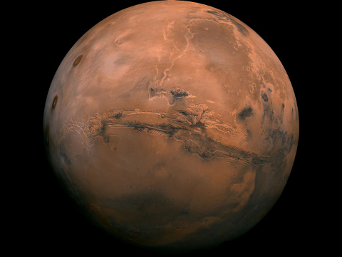 Mars Global View of Valles Marineris: Mosaic of the Valles Marineris hemisphere of Mars projected into point perspective, a view similar to that which one would see from a spacecraft. The distance is 2500 kilometers from the surface of the planet, with the scale being .6km/pixel. The mosaic is composed of 102 Viking Orbiter images of Mars (Credit: NASA/JPL-Caltech)