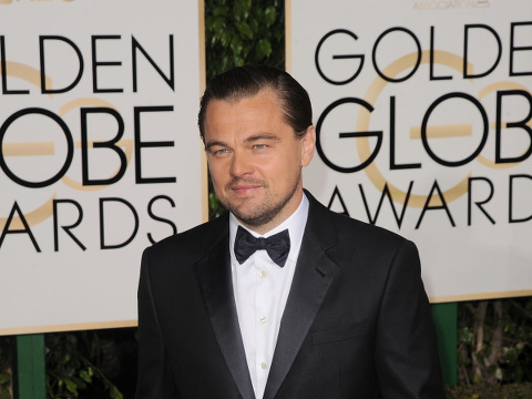Leonardo DiCaprio poses for a photo on the red carpet as he arrives at the Beverly Hills Hilton for the 73rd annual Golden Globe Awards, Beverly Hills, California, January 10, 2016 (Credit: AP Images/David Crotty)