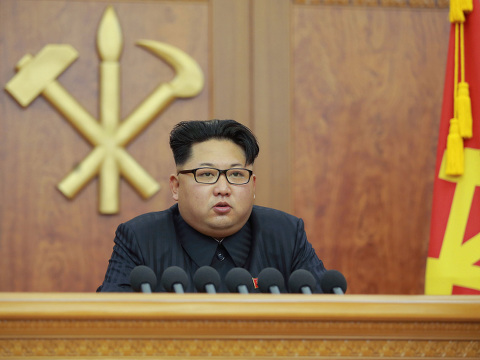 North Korean leader Kim Jong Un giving a nationally televised 2016 New Year's address (Credit: AP Images/Kyodo)