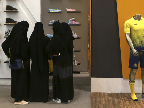 Saudi women shop at a mall in Riyadh, Saudi Arabia. The kingdom has announced on Monday, Dec. 28, 2015 a projected budget deficit in 2016 of $87 billion (327 billion riyals), as lower oil prices cut into the government's main source of revenue. (Credit: AP Photo/Khalid Mohammed)