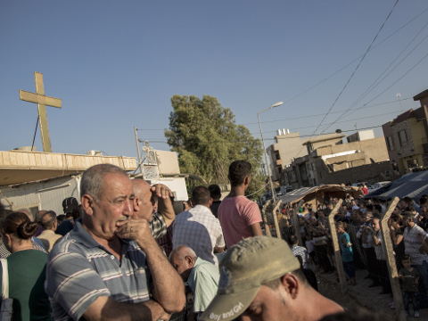 ERBIL, IRAQ - AUGUST 11, 2014 - A man stands still outside the Mar Tshmony church. 500 Christian families have been sheltered at Mar Tshmony church, after an unprecedented ISIS advance into Kurdish controlled territory, mainly Qaraqosh for the second time. These refugees are begging for passports to get out Iraq and even called on Western governments to offer them asylum as their culture faces the danger of extinction. (Credit: Photo by Vianney Le Caer / Pacific Press/Sipa USA)